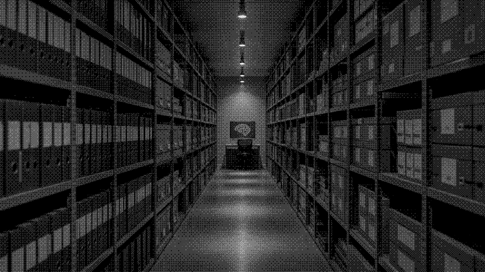 An archive aisle running to a single lit workstation